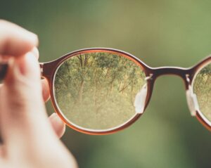 Person with Long-sightedness Glasses. What is Long-sightedness for Cathedral Eye Clinic