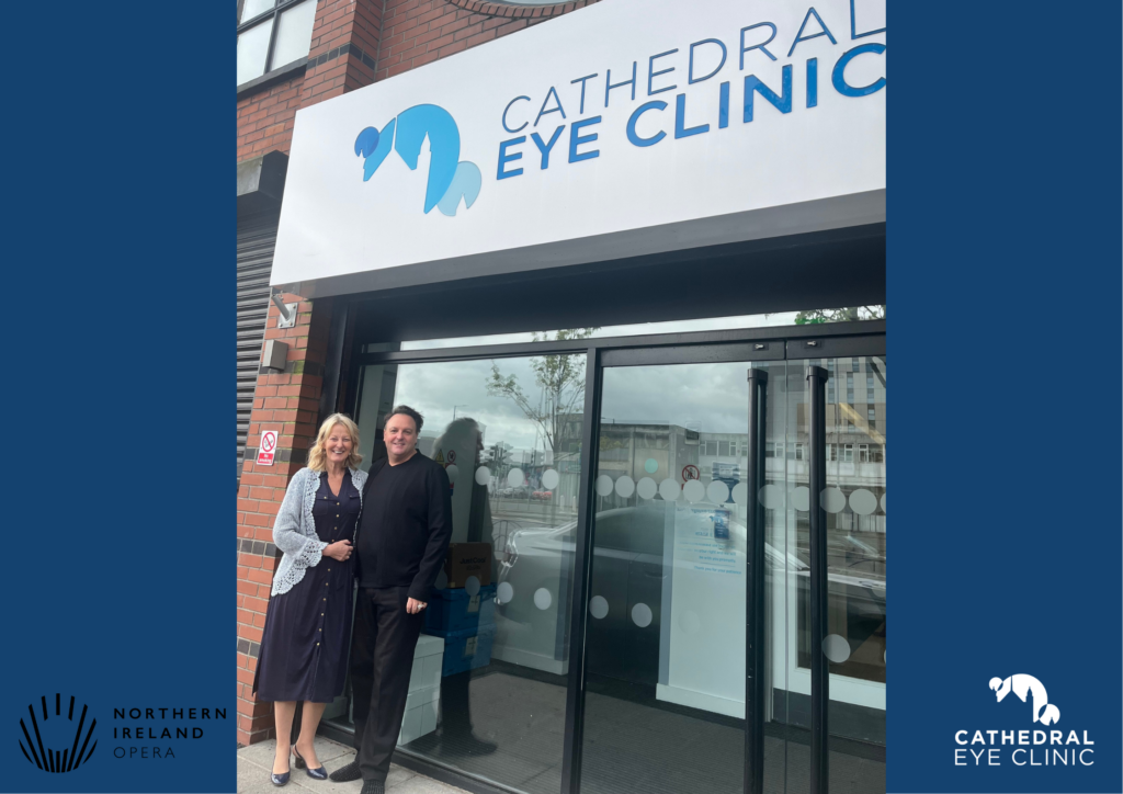 Image of Cameron Menzies, Chief Executive & Artistic Director of Northern Ireland Opera and COO Joyce Shaw, outside Cathedral Eye Clinic.