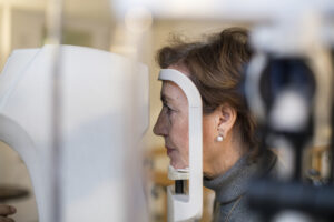 Senior woman during an eye testing. About 60 years old female patient, Caucasian.
